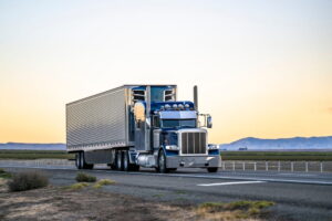 commercial semi truck driving on highway representing truck accident risks in West Palm Beach