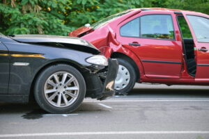 Two vehicles damaged after collision on roadway